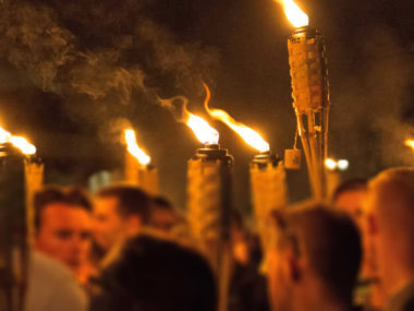 White supremacists carry torches on the grounds of the University of Virginia, on the eve of a planned "Unite the Right" rally in Charlottesville, Virginia, Aug. 11, 2017. Photo courtesy of VOA via Reuters.